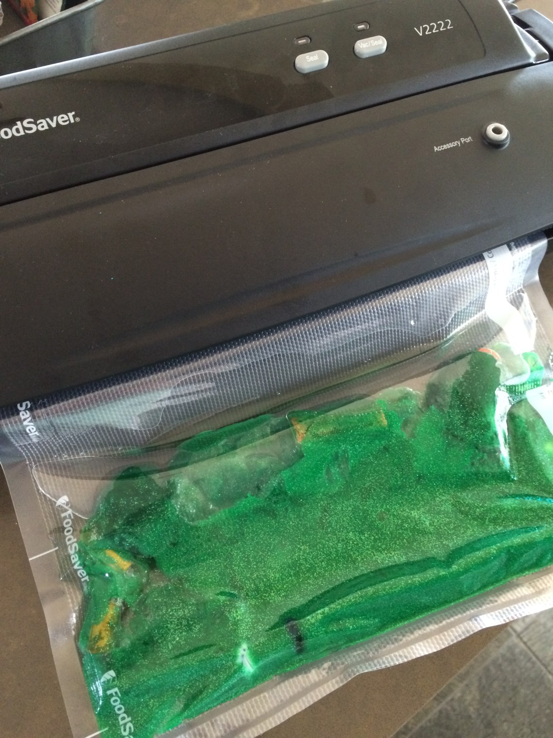 contents green glitter sensory mat pompoms rubber bands beads foodsaver seale